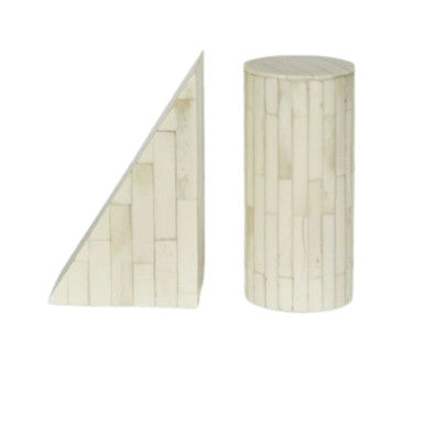 Two white bookends with a bone inlay design, one shaped like a cylinder and the other like a triangle, against a plain background.