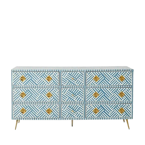 Patterned dresser with gold accents on a white background