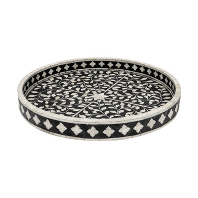 A round decorative tray with a black background featuring a floral bone inlay design.