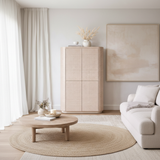 Modern living room with wooden cabinet, round coffee table, and white sofa.