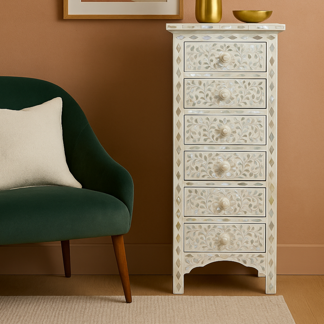 Decorative chest of drawers with floral patterns next to a green armchair in a room with a brown wall.