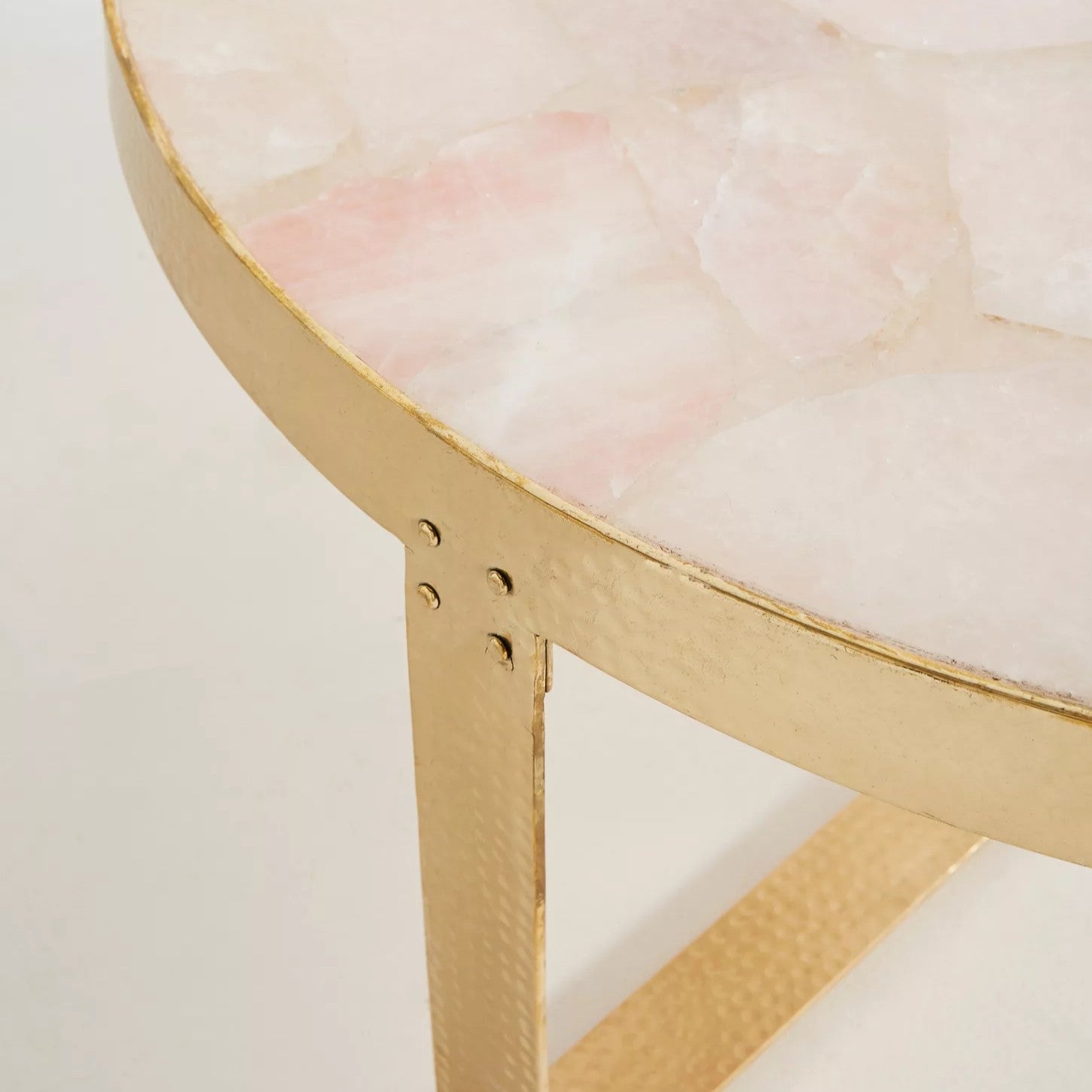 Pink stone top gold table