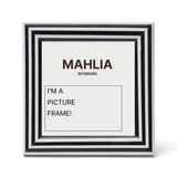 Black and white picture frame with 'MAHLIA INTERIORS' branding and text inside.