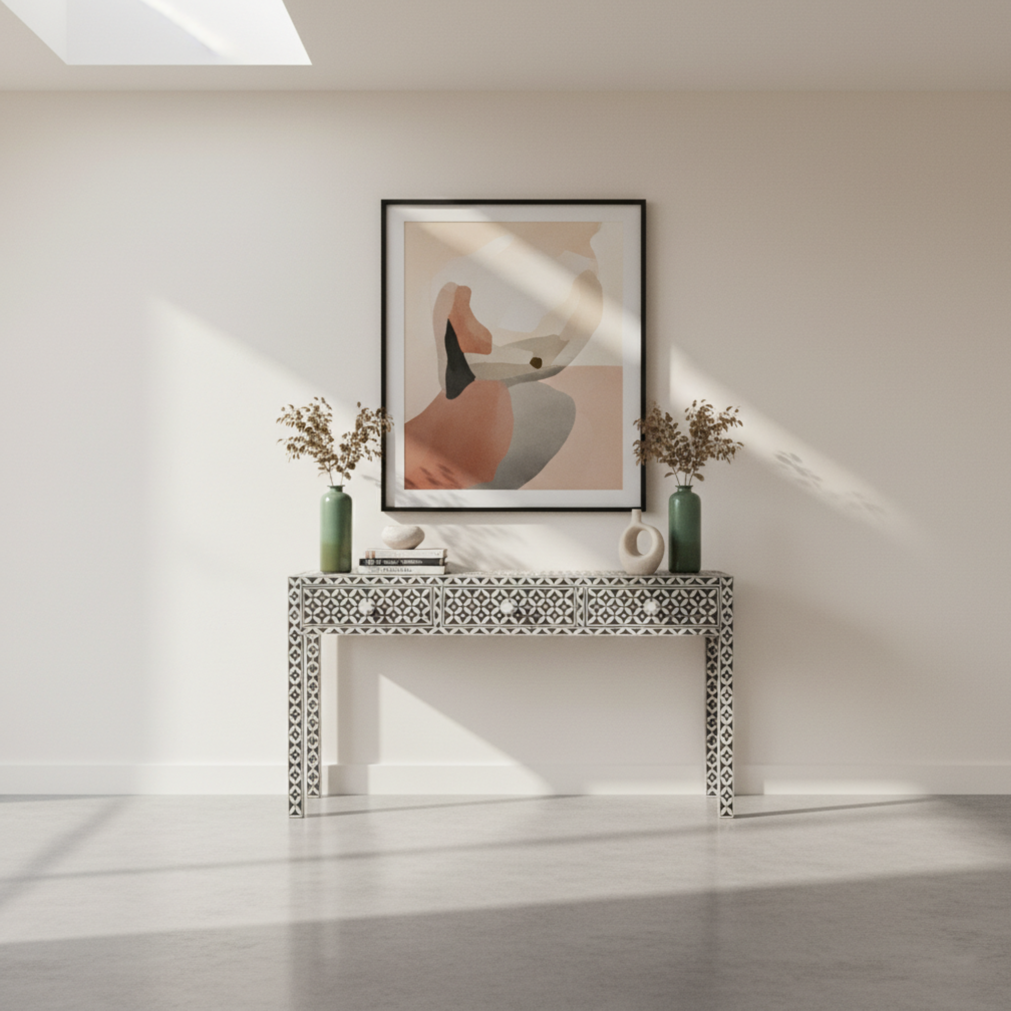 Modern interior with a console table, decorative vases, and abstract art on a white wall.