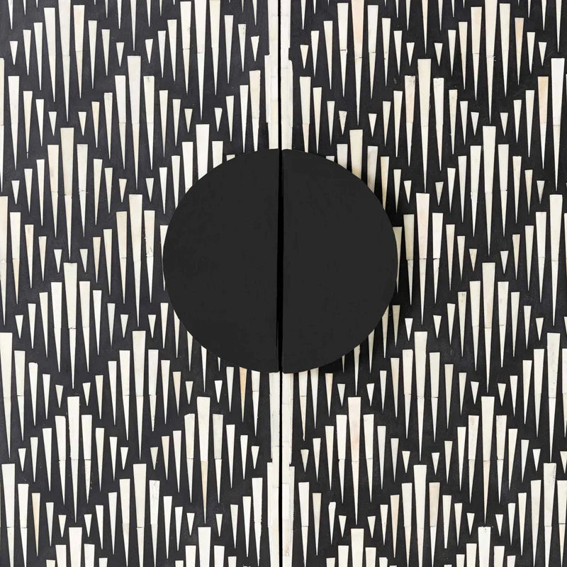 Black and white abstract pattern with a central black circle