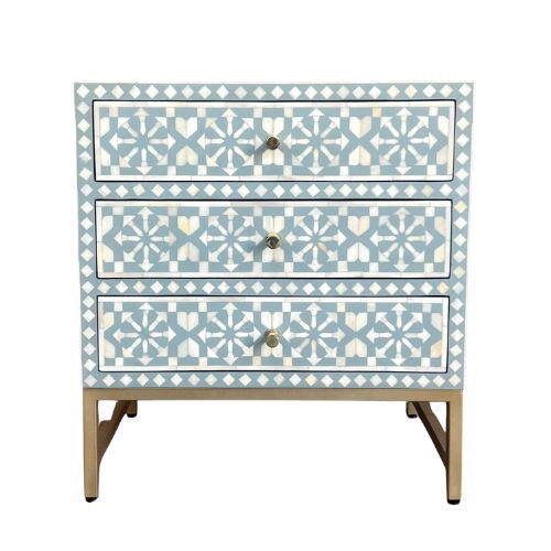 Three-drawer chest with decorative blue and white pattern on a white background