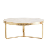 Coffee table with marble top and gold metal frame on a white background