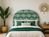 Bedroom with green patterned headboard and matching bedding