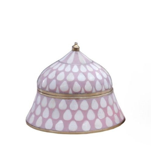 A conical rose-colored bone and brass box with a traditional raindrop pattern and a brass handle on top.