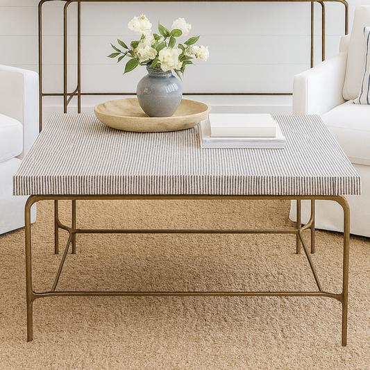 Coffee table with decorative items in a living room setting