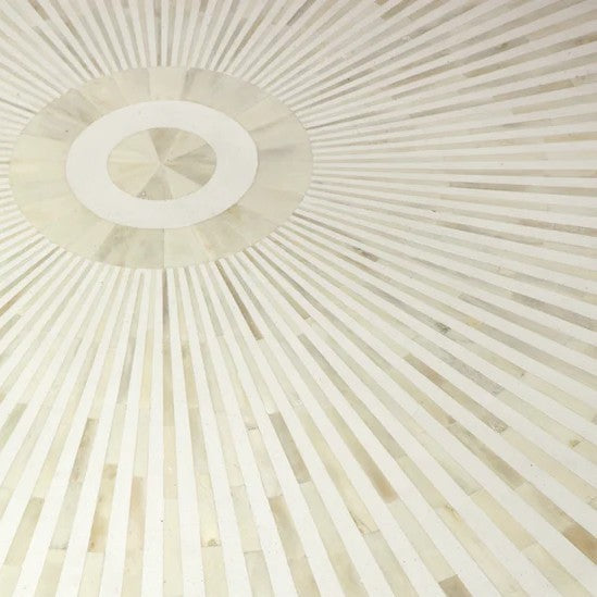 Close-up of a textured white surface with radiating lines