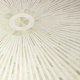 Close-up of a textured white surface with radiating lines