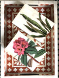 Decorative box with floral design on a patterned background