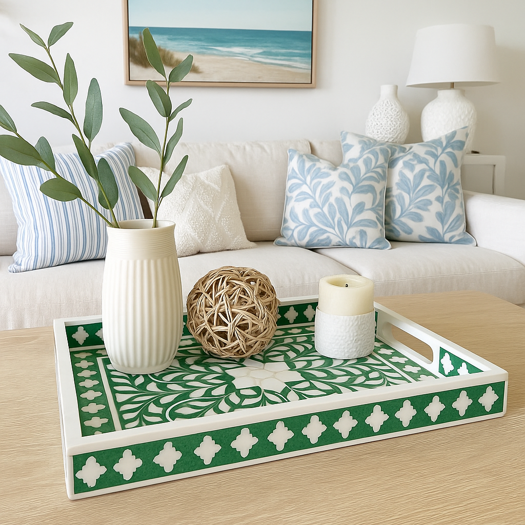 Decorative tray with green and white pattern on a coffee table in a living room.