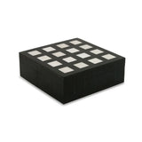 Black jewelry box with white stones on a white background