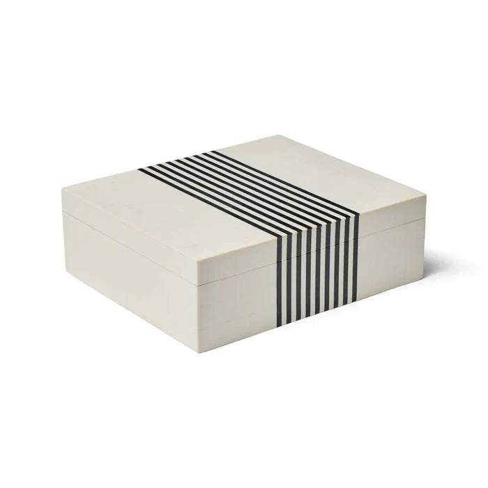White jewelry box with black striped band on a white background