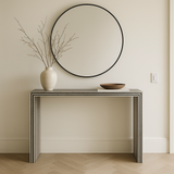 Console table with a vase and mirror in a minimalistic room