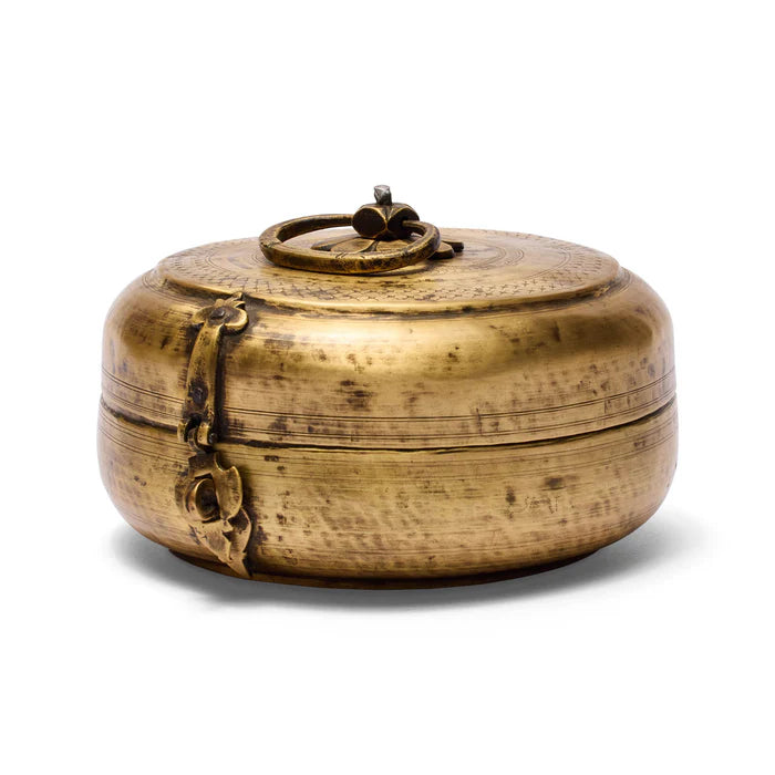 Brass box with decorative elements on a white background
