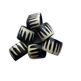 Black and white striped candy on a white background