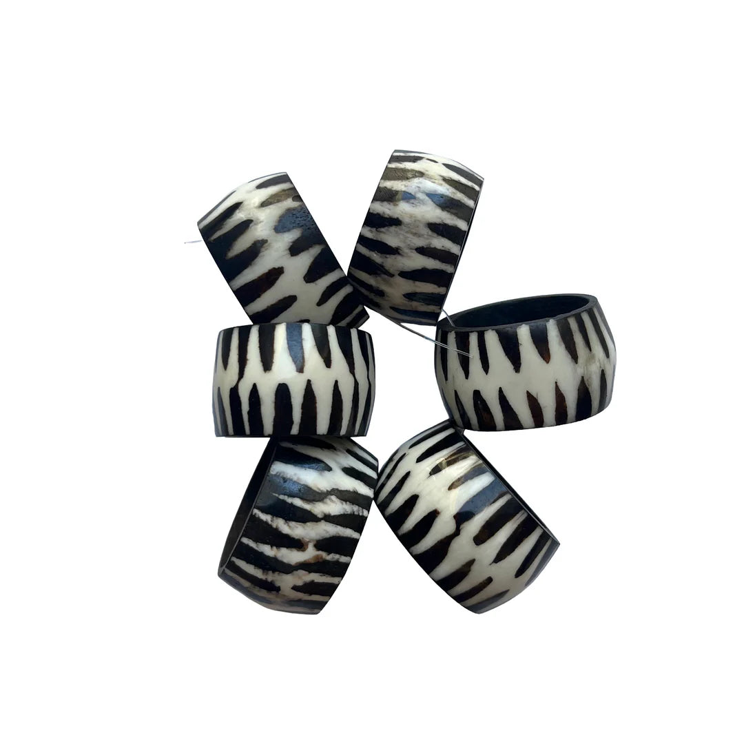 Set of zebra-patterned bracelets on a white background