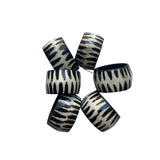 Set of zebra-patterned bracelets on a white background