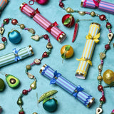 Colorful Christmas crackers and decorations on a blue background