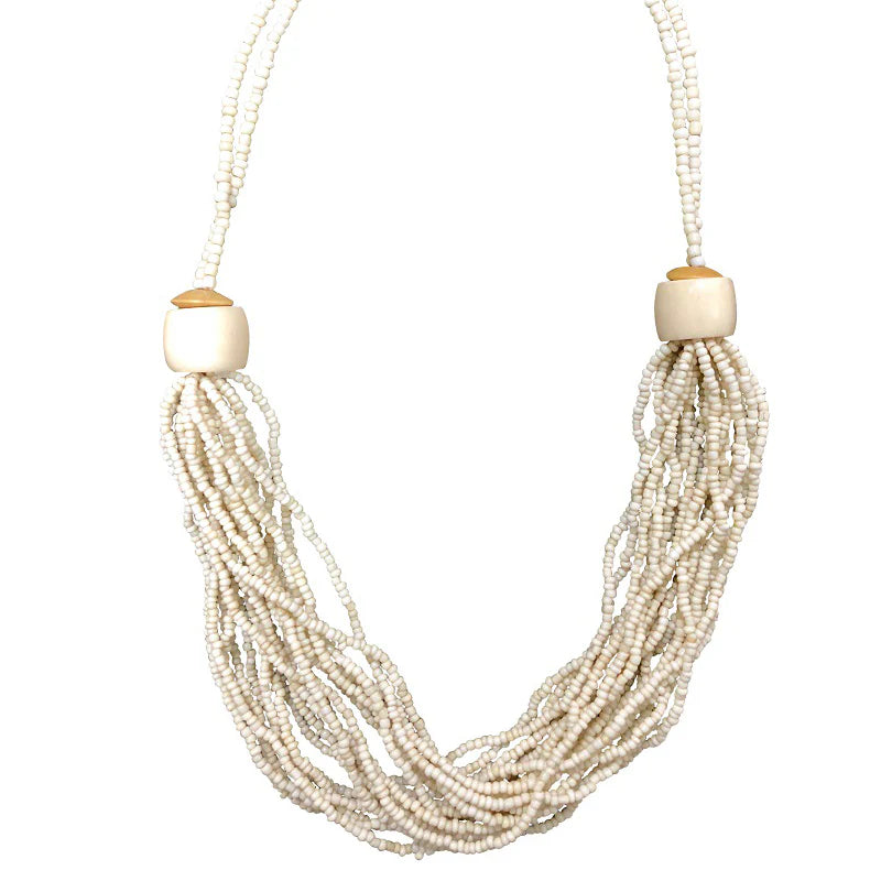 Necklace with multiple strands of pearls and wooden beads on a white background