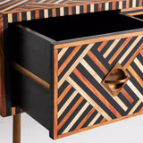 Wooden drawer with geometric pattern and gold handle on a white background