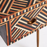 Wooden side table with geometric pattern on a white background