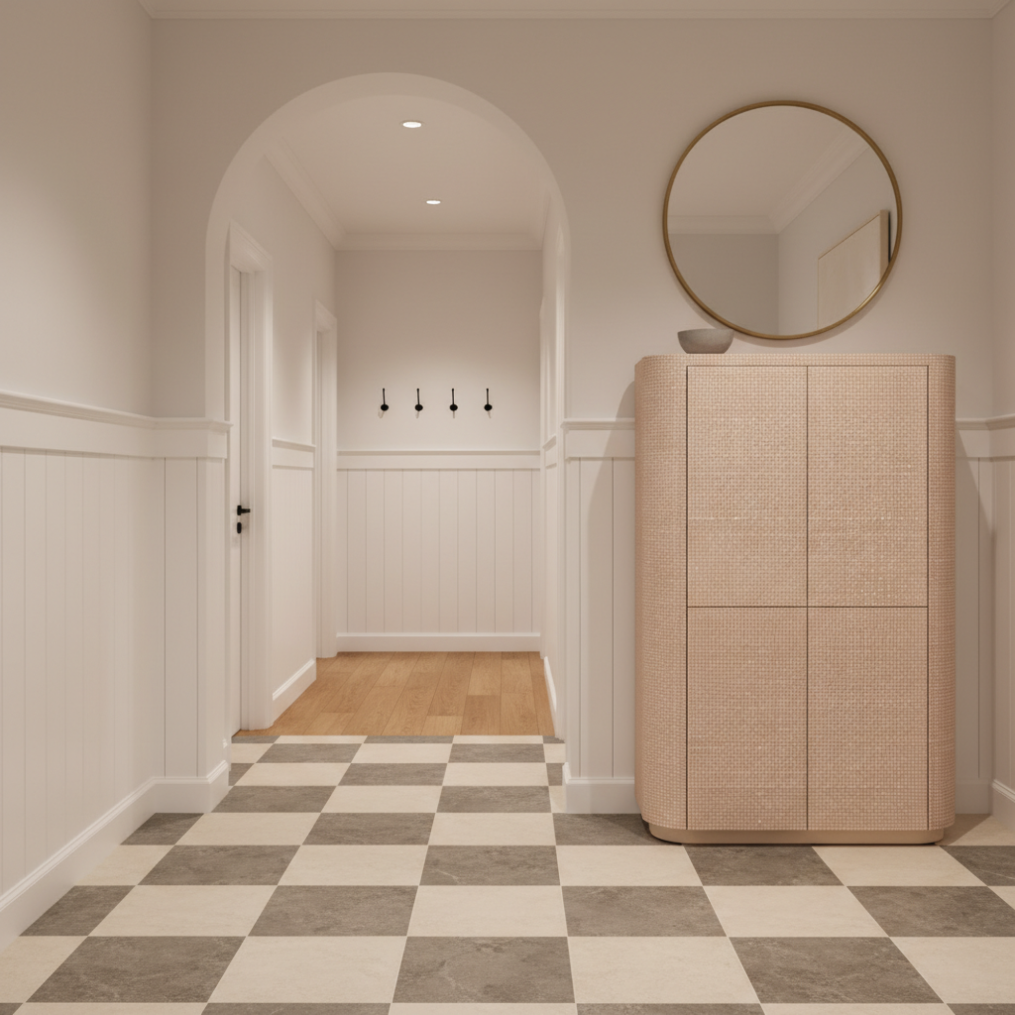 Modern hallway with a wooden cabinet and round mirror.