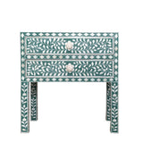 Decorative side table with floral patterns on a white background