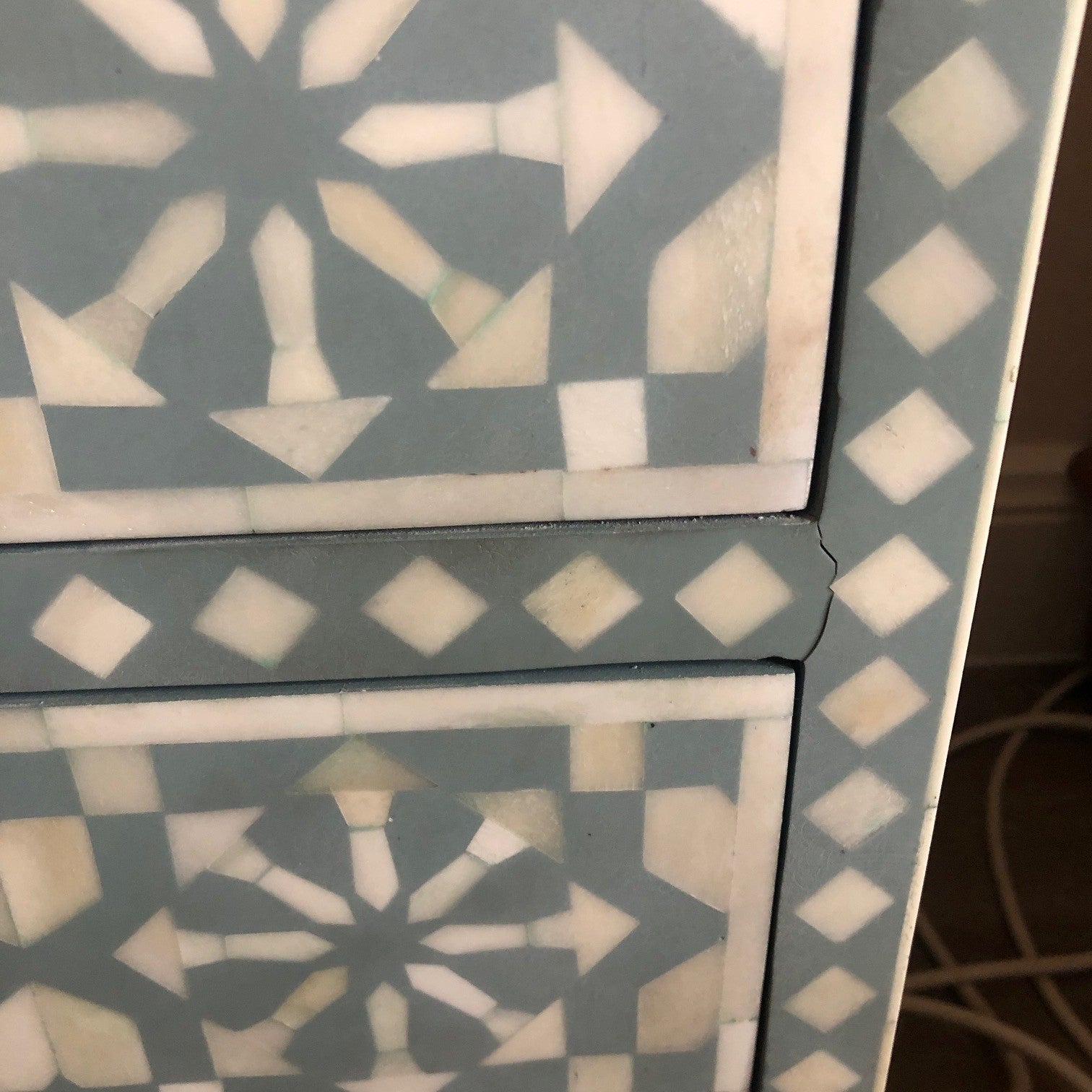 Close-up of a decorative tile with geometric pattern