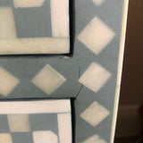 Close-up of a geometric patterned tile with a focus on a corner.