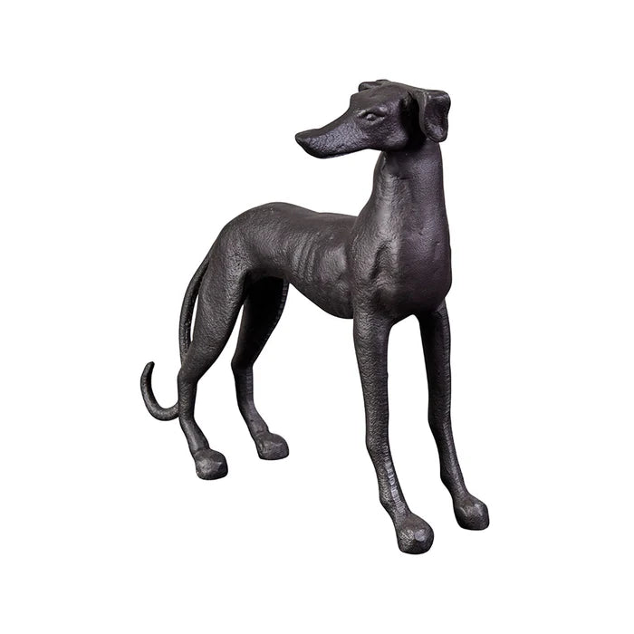 Black cast iron dog figurine on a white background