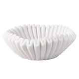 White ceramic bowl with ribbed texture on a white background