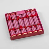 Box of pink striped crackers with red bows and 'Vixen's Velvet' branding on a light gray background.