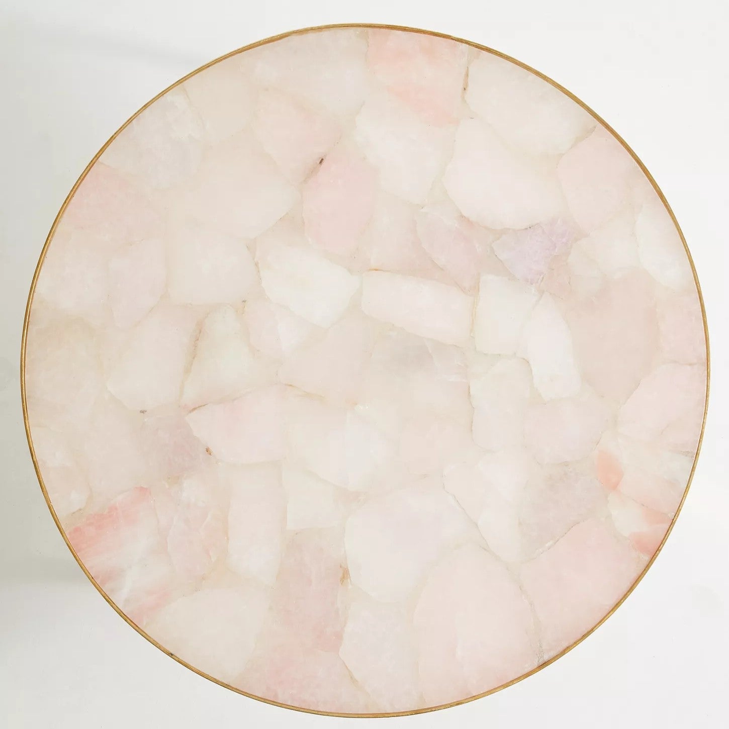 Round marble table with pink and beige marbled pattern on a white background