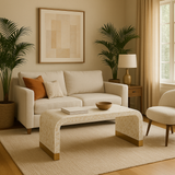 Cozy living room with beige sofa, coffee table, and decorative elements.