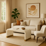 Cozy living room with beige sofa, armchair, and coffee table.